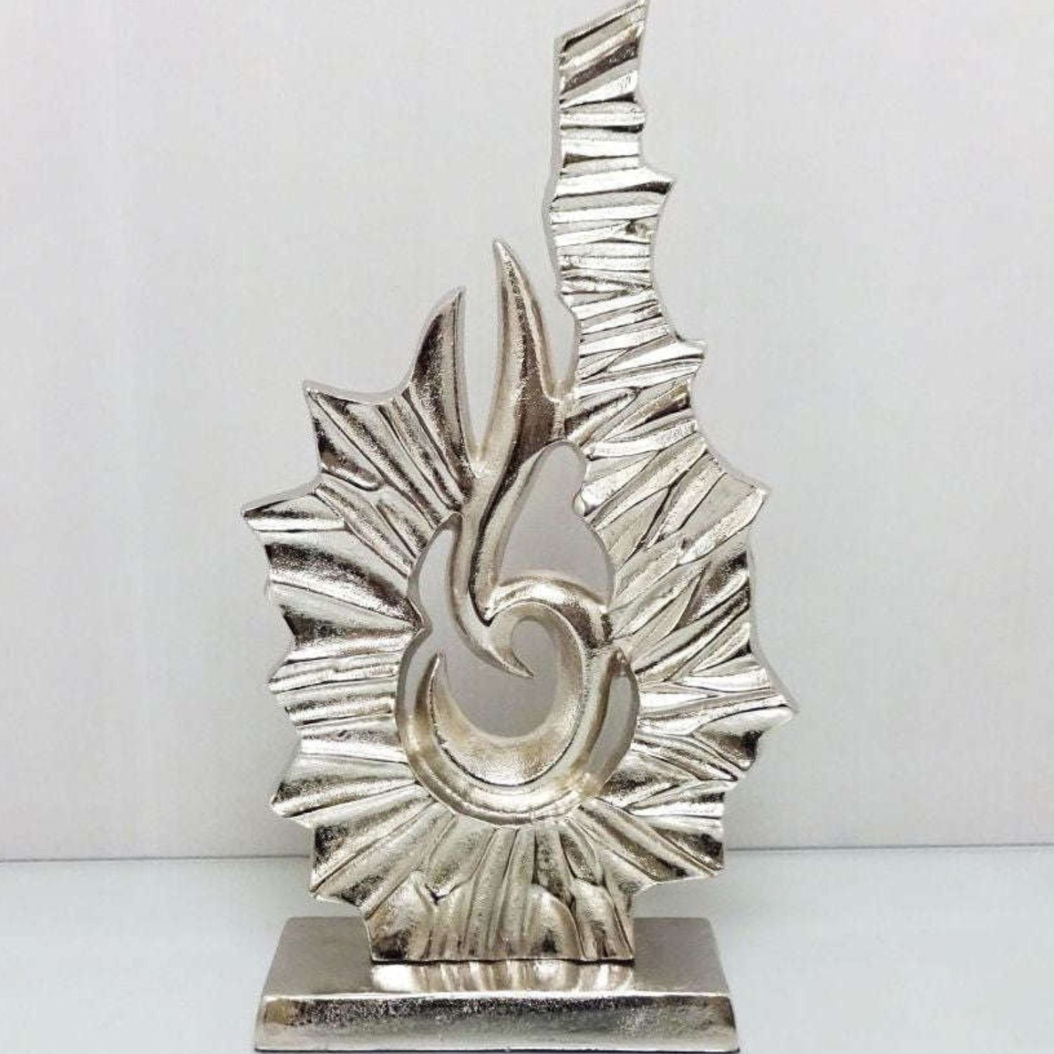 Large silver sculpture ornament in an abstract design