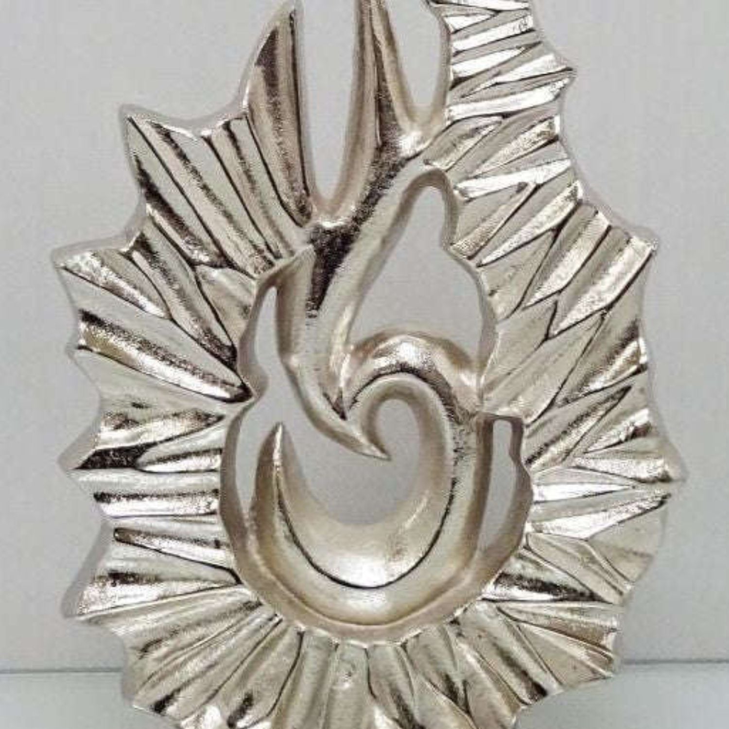 Silver sculpture ornament in an abstract design
