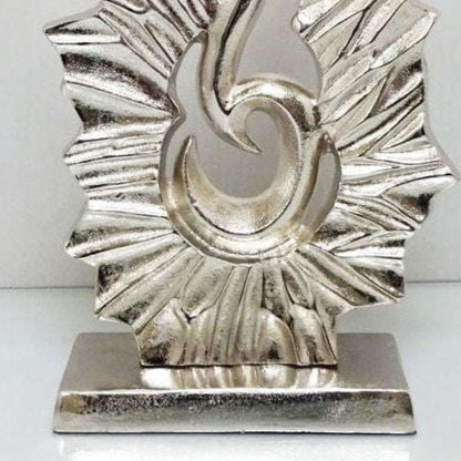 Large silver sculpture ornament in an abstract design