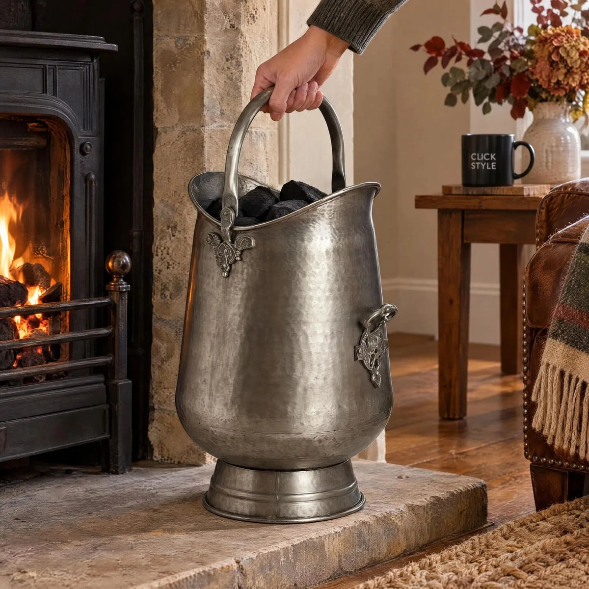 Antique Pewter Effect Silver & Gunmetal Tall Coal Bucket with Arched Handle – Decorative Metal Fireside Coal Scuttle 50x26x36cm – Arched Handle Being Held Beside Traditional Fireplace | Click Style