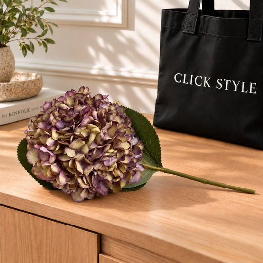 Artificial Burgundy & Plum Hydrangea Stem with Realistic Green Leaves – Lifelike Faux Purple Hydrangea Flower 42x18x18cm – Full Single Stem Lying on Oak Sideboard with Black CLICK STYLE Branded Bag | Click Style