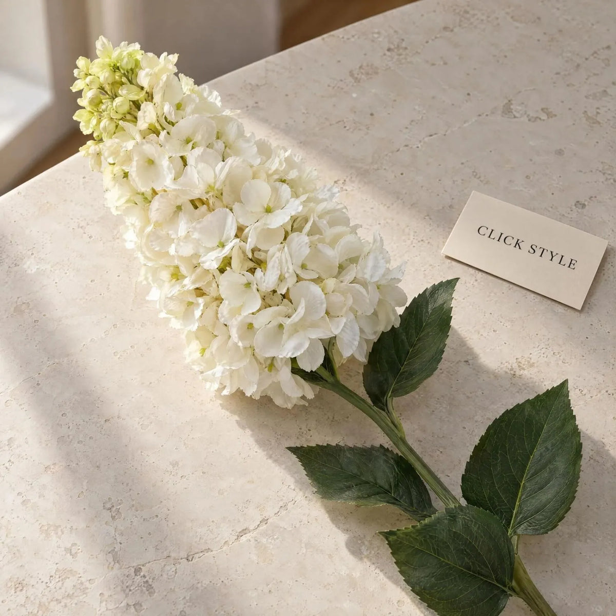 Artificial Creamy White Long Stem Spear Hydrangea with Pointed Flower Head & Realistic Green Leaves – Tall Faux Cream Hydrangea Flower 88cm showing detailed ivory petals, pale green flower tips and dark green leaves on a limestone surface | Click Style