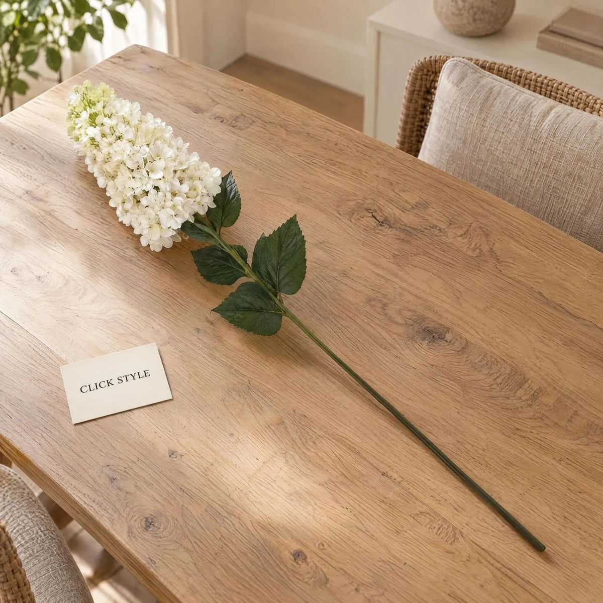 Artificial Creamy White Long Stem Spear Hydrangea with Pointed Flower Head & Realistic Green Leaves – Tall Faux Cream Hydrangea Flower 88cm displayed diagonally on a natural oak dining table with CLICK STYLE branding | Click Style