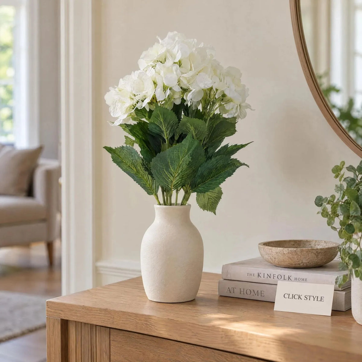 Artificial Creamy White Multi-Bloom Hydrangea Bouquet Stem with Realistic Green Foliage – Lifelike Faux Cream Hydrangea Arrangement 54x34x34cm Styled in Ivory Ceramic Vase on Oak Dining Table with Linen Runner and LED Candle | Click Style