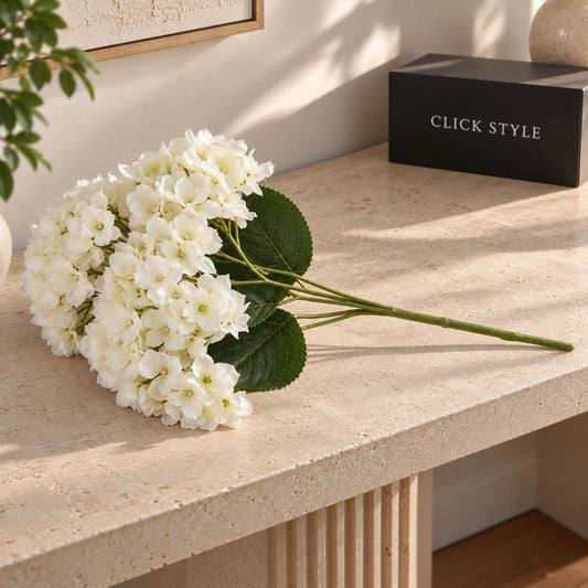 Artificial Creamy White Multi-Bloom Hydrangea Stem with Realistic Green Leaves – Lifelike Faux White Hydrangea Flower 47x23x23cm – Full stem displayed on a limestone console with black CLICK STYLE branding | Click Style