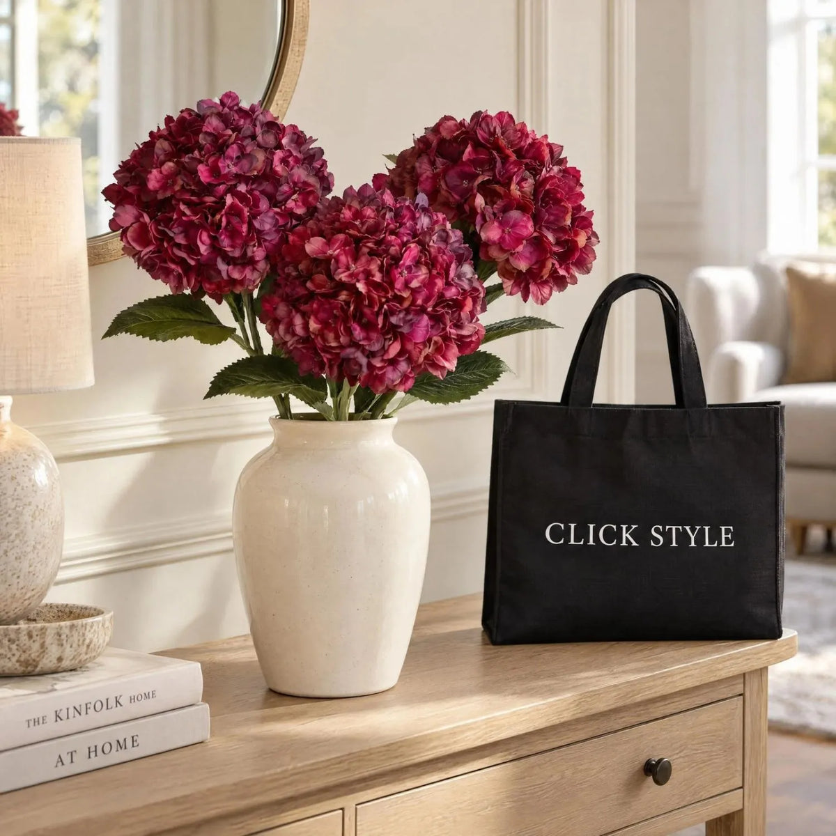 Artificial Deep Ruby Red & Burgundy Hydrangea Stem with Realistic Green Leaves – Lifelike Faux Red Hydrangea Flower 42x18x18cm – Three Ruby Red and Burgundy Artificial Hydrangea Stems Arranged in a Cream Ceramic Vase on a Pale Oak Console Table with Black CLICK STYLE Branded Tote Bag | Click Style