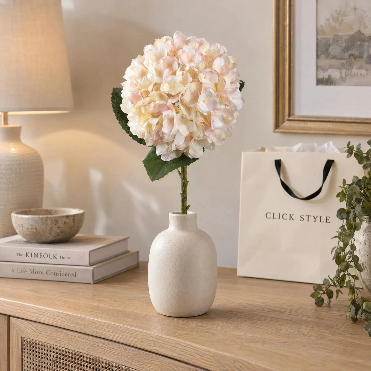 Artificial Peach Blush & Cream Hydrangea Stem with Realistic Green Leaves – Lifelike Faux Pink Hydrangea Flower 42x18x18cm styled in an ivory ceramic vase on a wooden console table | Click Style
