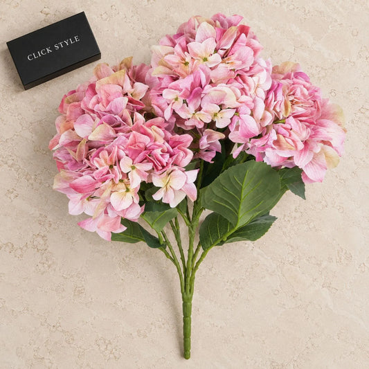 Artificial Pink Multi-Bloom Hydrangea Bouquet Stem with Realistic Green Leaves – Lifelike Faux Pink Hydrangea Flower Arrangement 58x47x47cm displayed on pale limestone with black CLICK STYLE box | Click Style