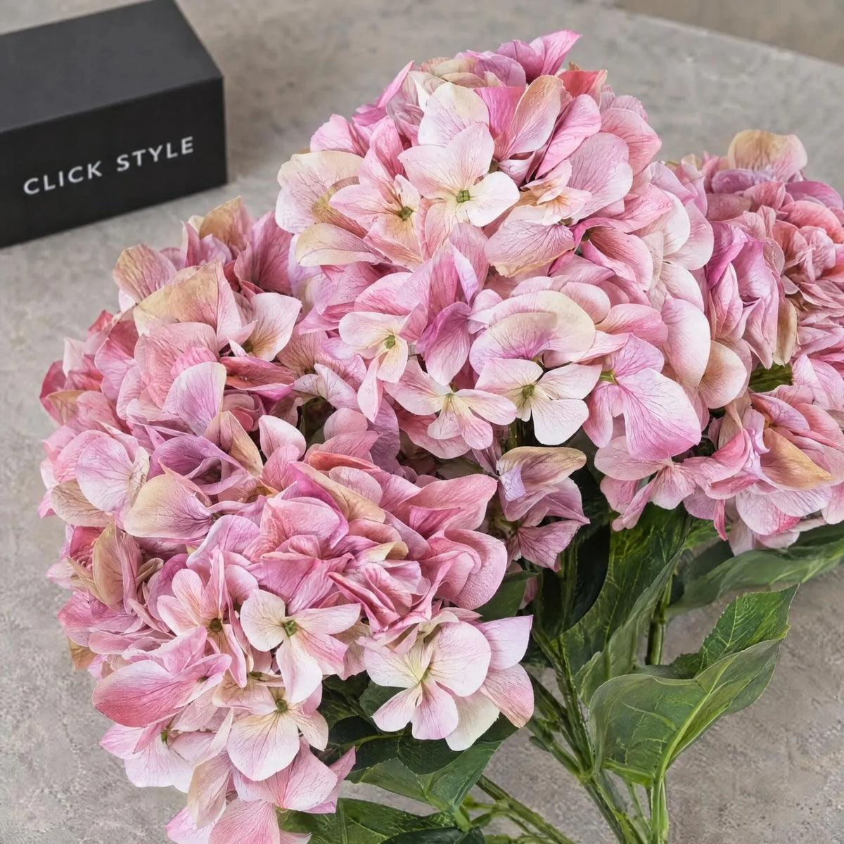 Artificial Pink Multi-Bloom Hydrangea Bouquet Stem with Realistic Green Leaves – Lifelike Faux Pink Hydrangea Flower Arrangement 58x47x47cm close-up showing detailed pink petals and green foliage | Click Style