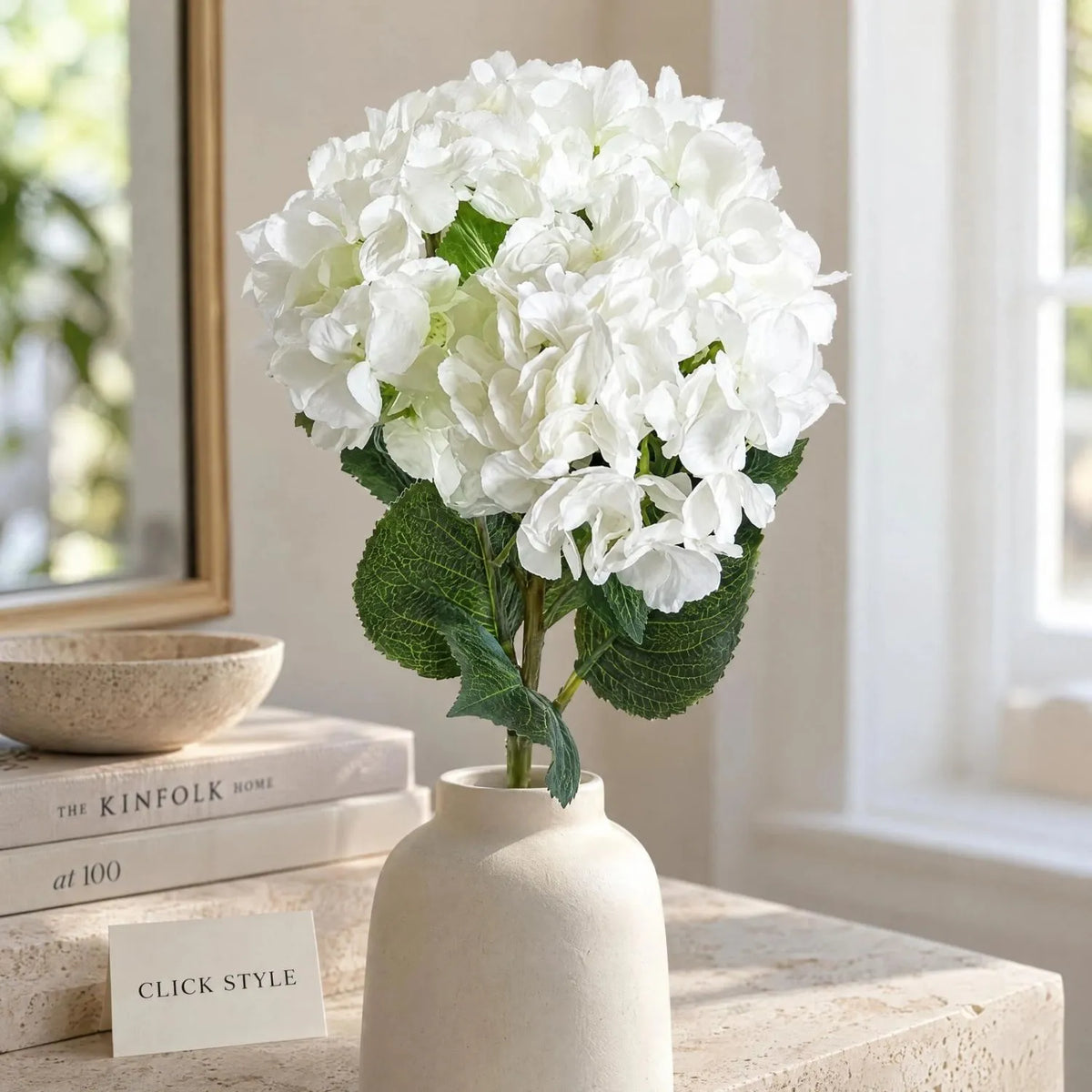 Artificial Pure White Long Stem Hydrangea with Full Rounded Flower Head & Realistic Green Leaves – Lifelike White Faux Hydrangea Flower 70cm – Close-Up of White Hydrangea Bloom with Textured Green Foliage in a Cream Ceramic Vase | Click Style