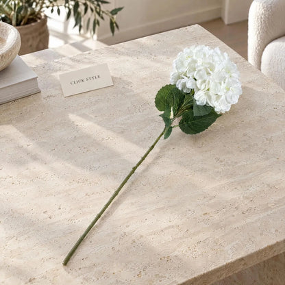 Artificial Pure White Long Stem Hydrangea with Full Rounded Flower Head & Realistic Green Leaves – Lifelike White Faux Hydrangea Flower 70cm – Single Artificial Hydrangea Stem Displayed on a Modern Travertine Surface | Click Style