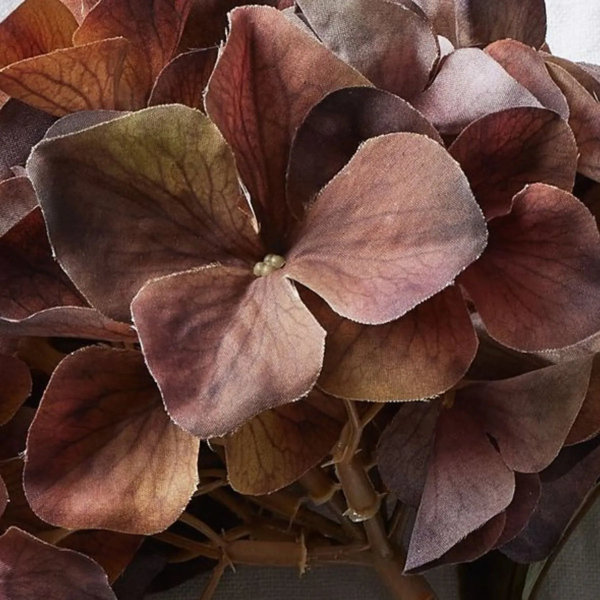 Artificial Russet Brown & Burgundy Hydrangea Stem with Realistic Autumn Foliage – Lifelike Faux Brown Hydrangea Flower 50x26x26cm – Macro close-up showing textured burgundy and russet petals with delicate veining and subtle colour variations | Click Style