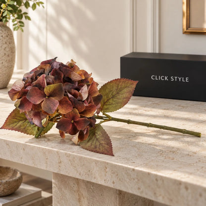 Artificial Russet Brown & Burgundy Hydrangea Stem with Realistic Autumn Foliage – Lifelike Faux Brown Hydrangea Flower 50x26x26cm – Single artificial hydrangea stem displayed horizontally on a pale limestone console with black CLICK STYLE branding | Click Style