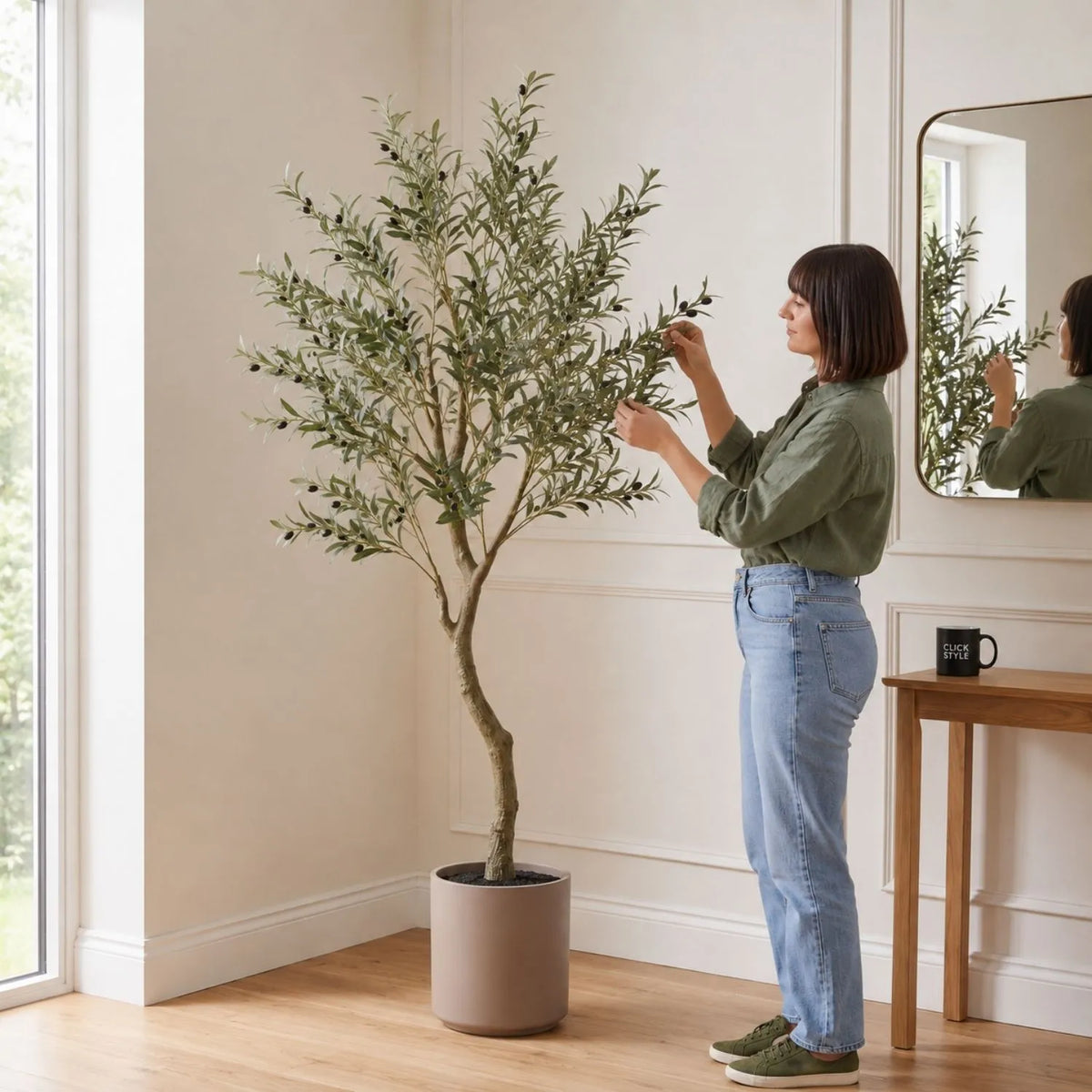 Artificial Tall Olive Tree with Black Olives & Taupe Pot styled with woman in neutral entrance hall | Click Style