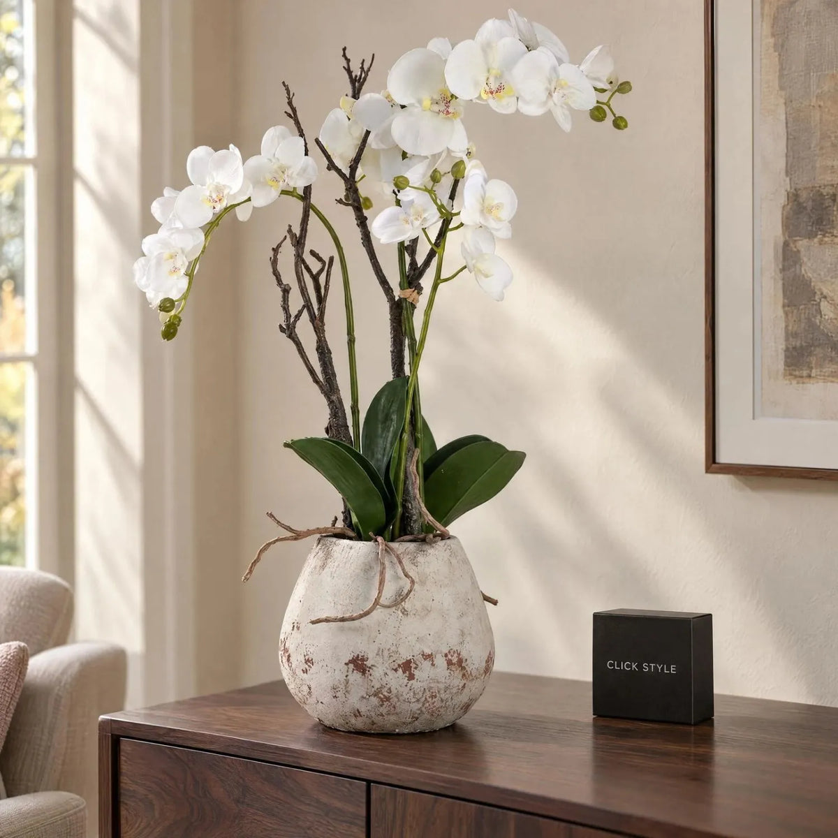 Artificial Tall White Orchid with Cascading Blooms Realistic Exposed Roots & Dark Green Leaves in Weathered Stone Effect Pot – Large Potted Faux Orchid Arrangement 70x46x46cm styled on a dark walnut sideboard in a warm neutral living room | Click Style