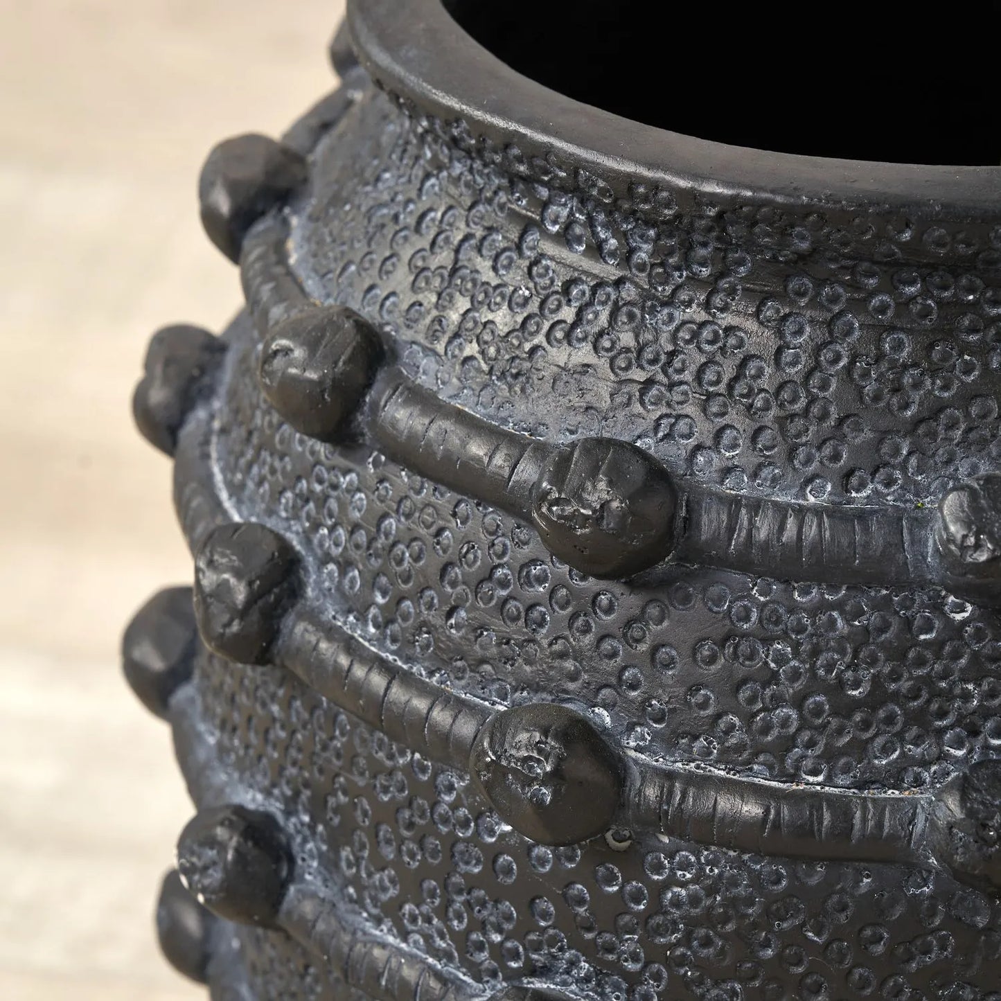 Black bobbled fibrestone decorative planter with textured stone-effect finish, indoor plant pot 29x32x32cm | Click Style