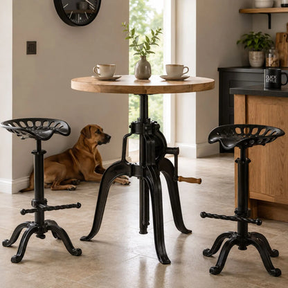 Black Industrial Style Heavy Duty Metal Adjustable Bar Table with Round Wood Top & Crank Handle with Two Matching Tractor Seat Bar Stools and Rhodesian Ridgeback in Modern Kitchen | Click Style