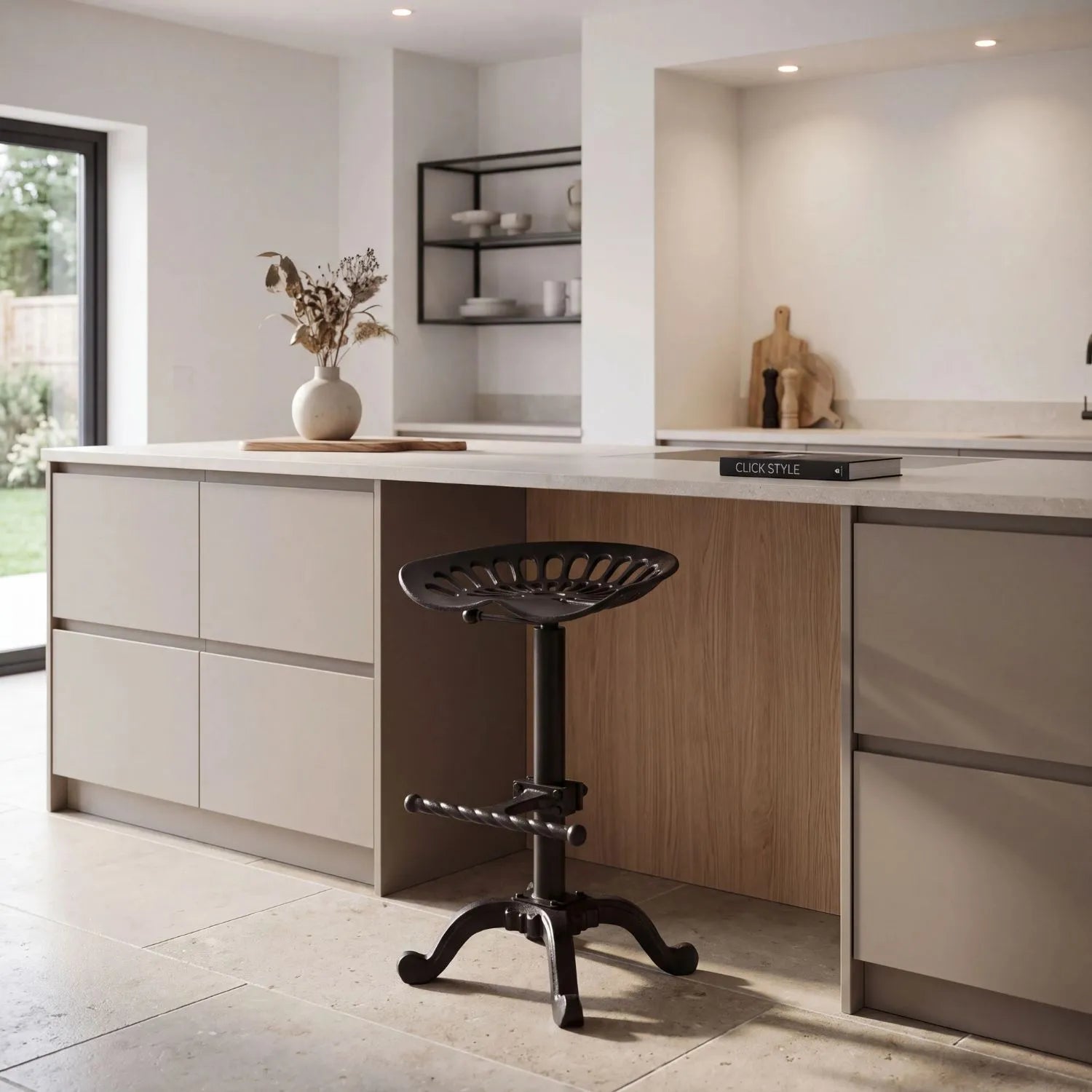 Black Industrial Style Heavy Duty Metal Adjustable Bar Table matching tractor seat bar stool styled beside stone kitchen island | Click Style