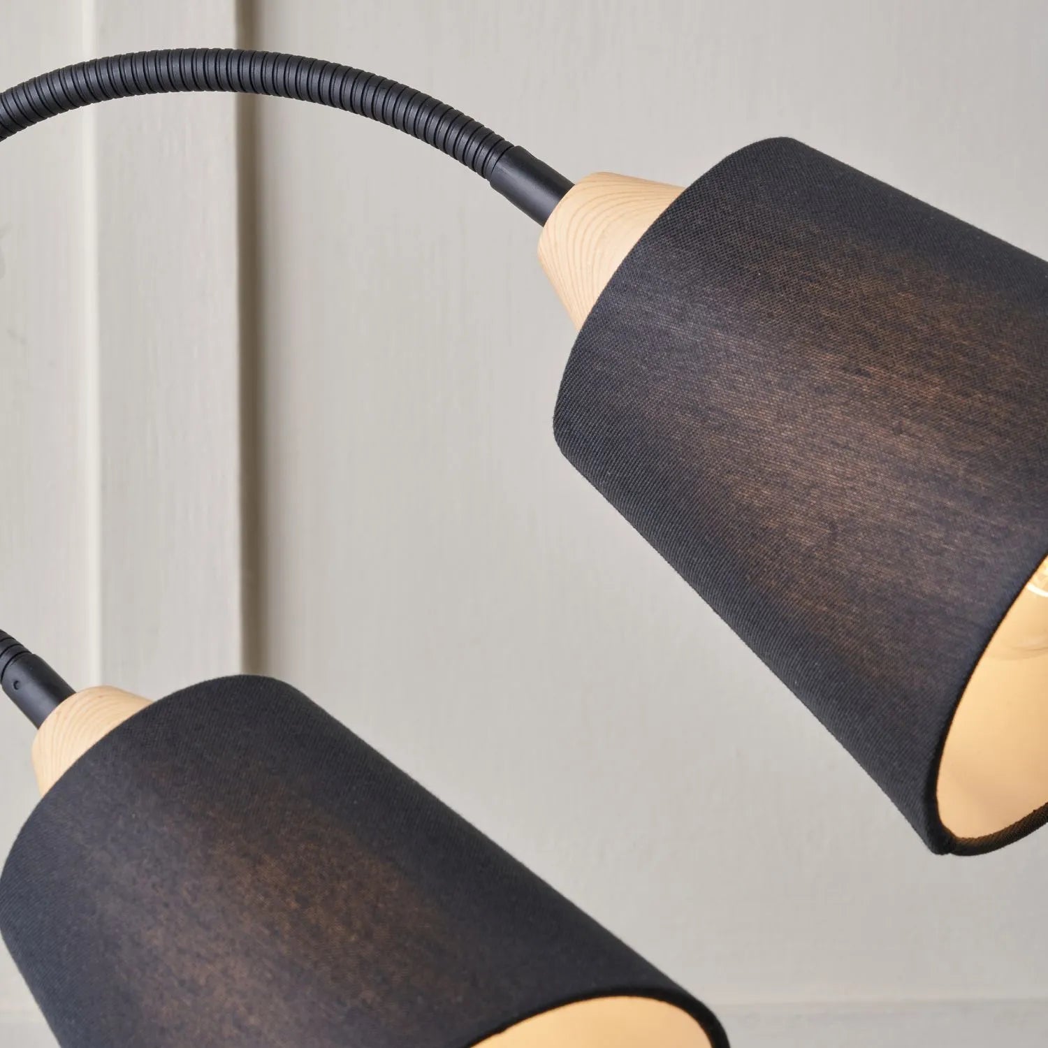 Black metal floor lamp with twin adjustable tapered linen shades and natural wood and metal base – modern double head standing light 160x56x24cm | Click Style