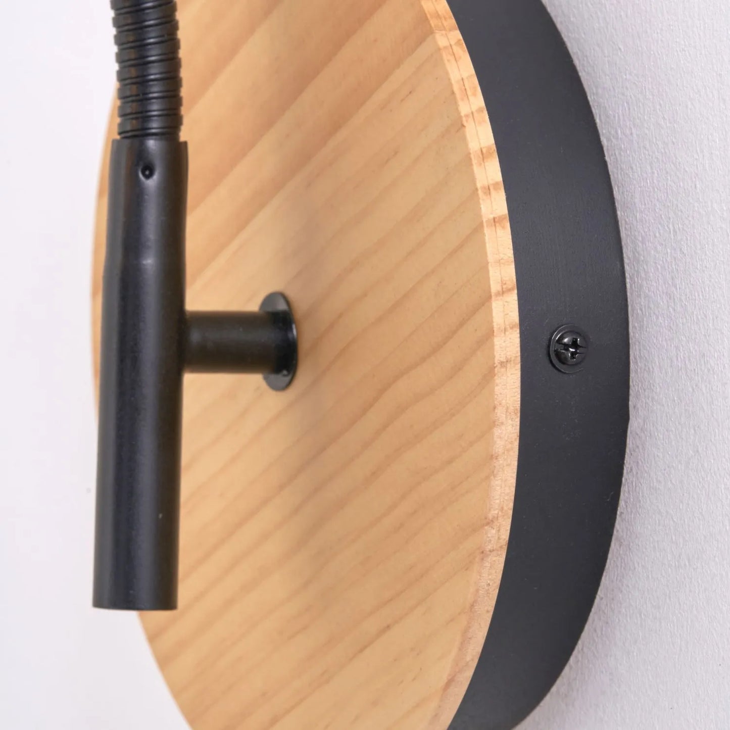 Black metal wall light with adjustable tapered linen shade and natural wood plate – modern bedside reading light | Click Style