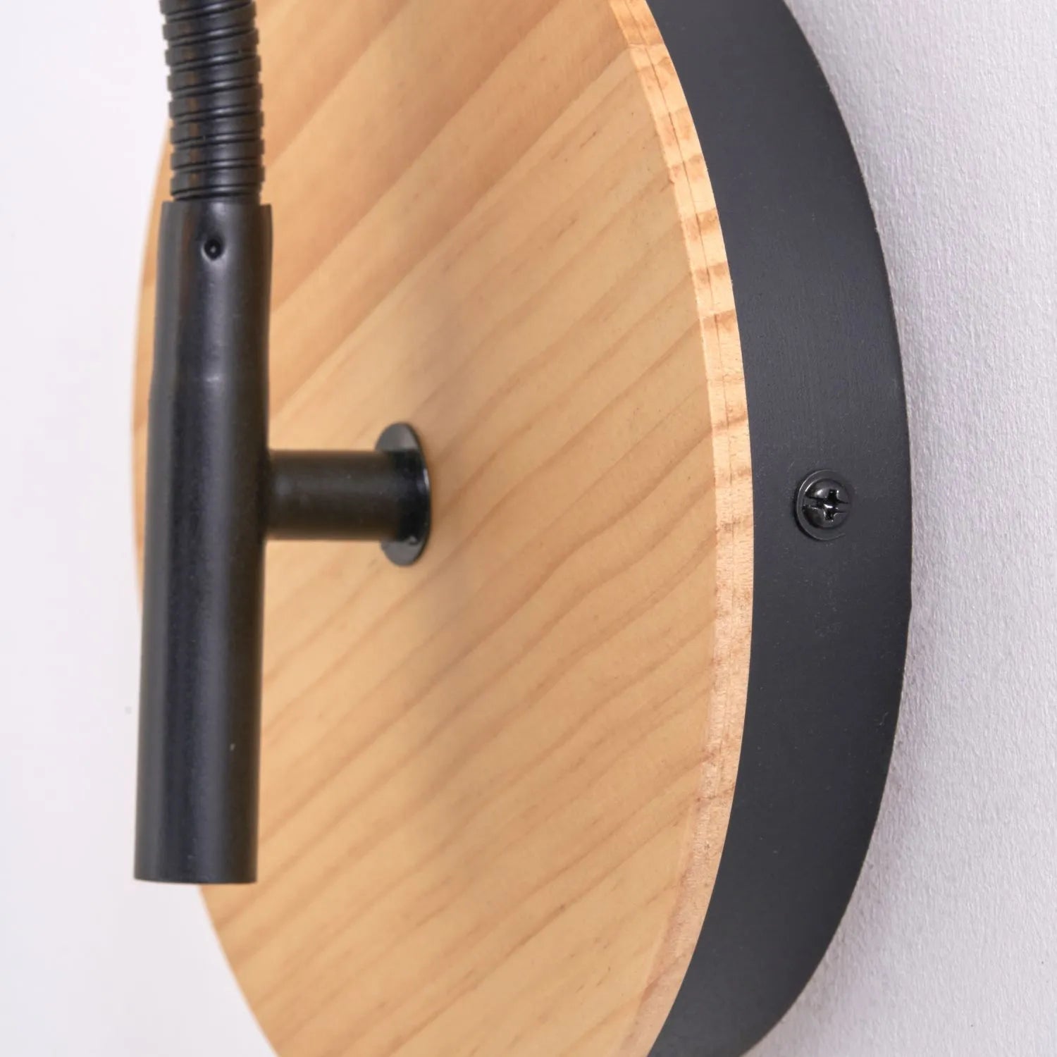 Black metal wall light with adjustable tapered linen shade and natural wood plate – modern bedside reading light | Click Style