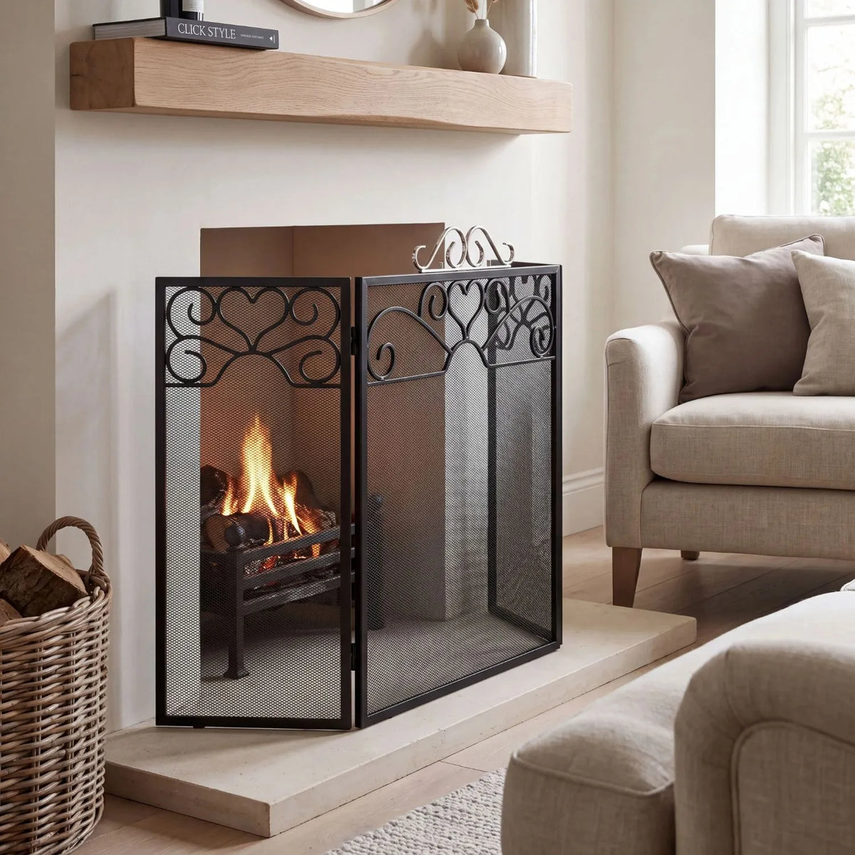 Black & Chrome 3 Panel Folding Firescreen with Decorative Scrollwork – Metal Fireplace Fire Guard 65x98x23cm angled view showing three-panel folding design | Click Style