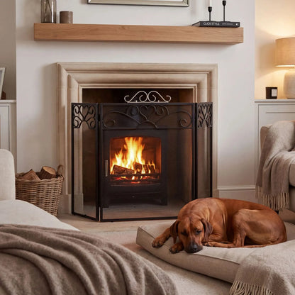 Black & Chrome 3 Panel Folding Firescreen with Decorative Scrollwork – Metal Fireplace Fire Guard 65x98x23cm in a cosy fireside living room with Rhodesian Ridgeback | Click Style