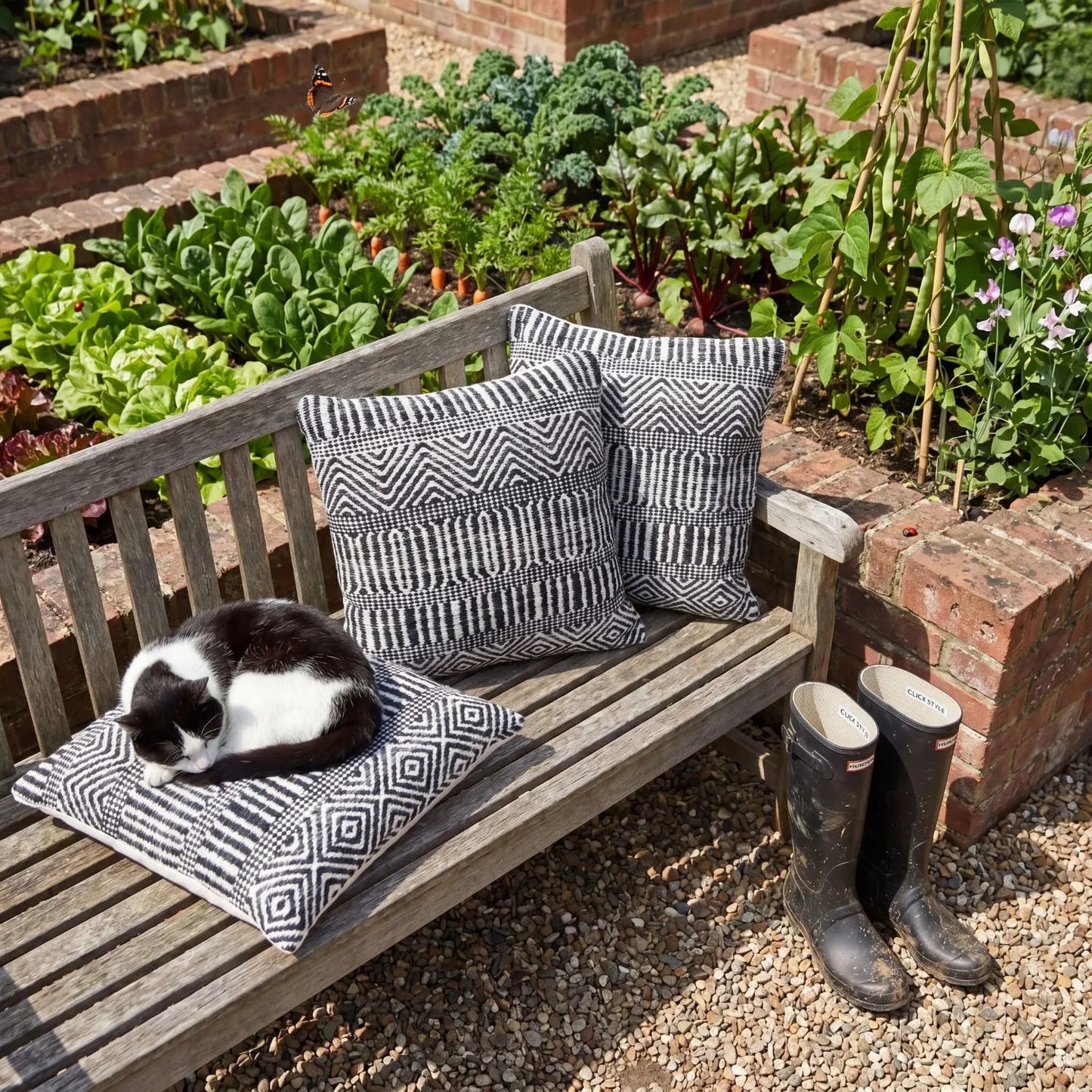 Black & White Square Indoor Outdoor Cushion with Tribal Pattern – Recycled Weather-Resistant & Durable 45x45x10cm featuring a bold black and white tribal-inspired geometric pattern, woven textured finish and recycled PET fabric for garden furniture, patios, balconies, conservatories and modern homes | Click Style