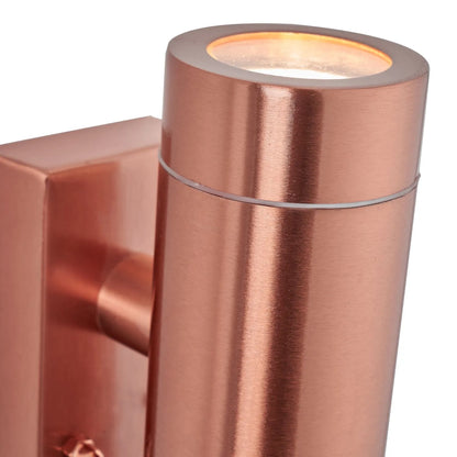 Brushed Copper Outdoor Up & Down PIR Motion Sensor Wall Light Illuminating an Exterior Wall with Dual Up and Down Light Beams | Click Style
