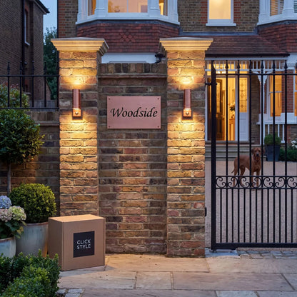 Brushed Copper Outdoor Up & Down PIR Motion Sensor Wall Light Illuminating an Exterior Wall with Dual Up and Down Light Beams | Click Style