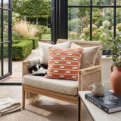 Burnt Orange & White Square Indoor Outdoor Cushion with Braided Bohemian Design – Recycled Weather-Resistant & Durable 45x45x10cm Styled on Garden Furniture in a Patio Seating Area with Warm Terracotta Tones and Natural Outdoor Styling | Click Style