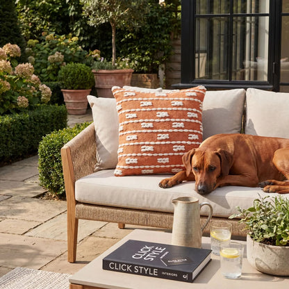 Burnt Orange & White Square Indoor Outdoor Cushion with Braided Bohemian Design – Recycled Weather-Resistant & Durable 45x45x10cm Styled on Garden Furniture in a Patio Seating Area with Warm Terracotta Tones and Natural Outdoor Styling | Click Style