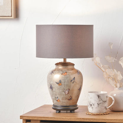 Jenny Worrall butterflies distressed gold and off-white bulbous glass table lamp base with antique brass feet – handcrafted small butterfly statement lighting 30x16x16cm | Click Style