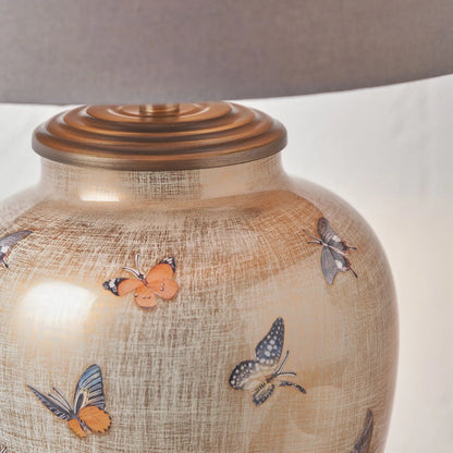 Jenny Worrall butterflies distressed gold and off-white bulbous glass table lamp base with antique brass feet – handcrafted small butterfly statement lighting 30x16x16cm | Click Style