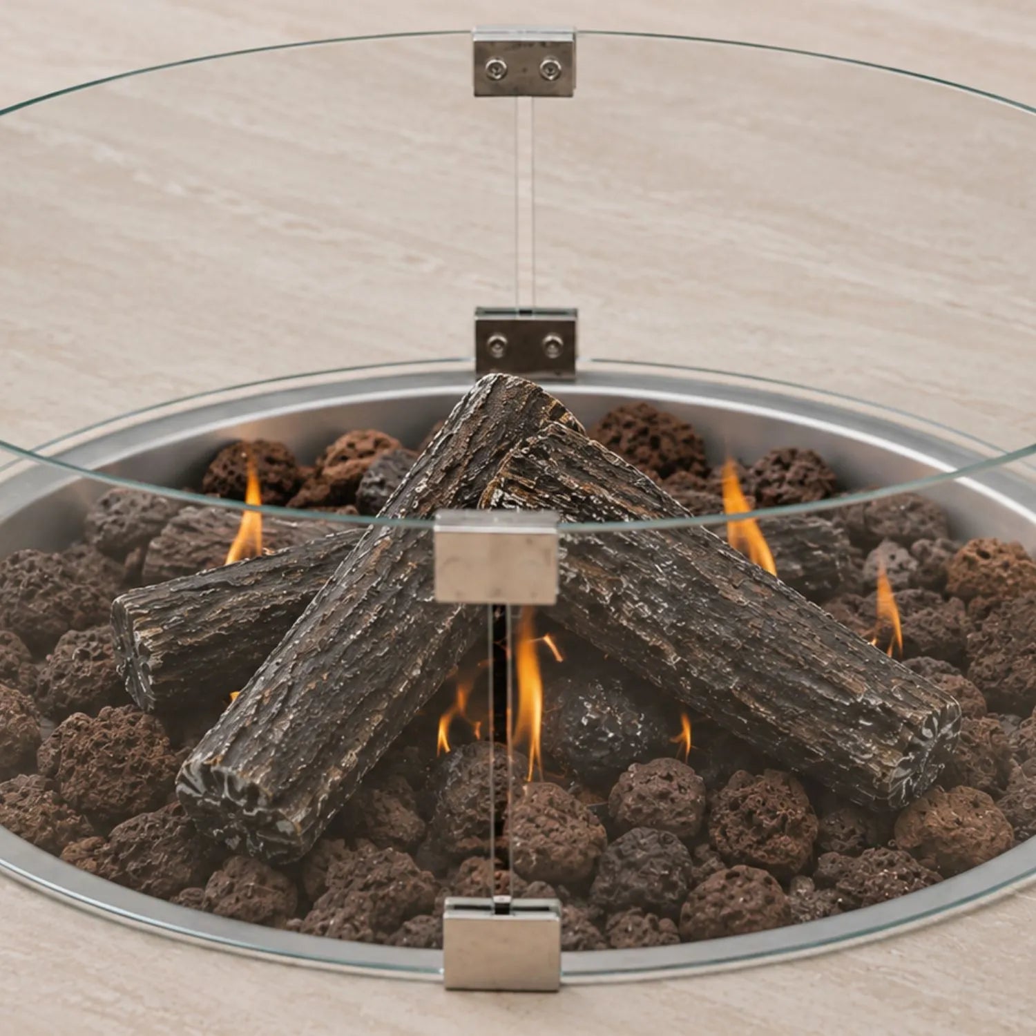 Cosiloft Novi Taupe Beige Outdoor Gas Fire Pit Coffee Table close up with Cosiglass Round Wind Guard, ceramic logs and lava stones | Click Style