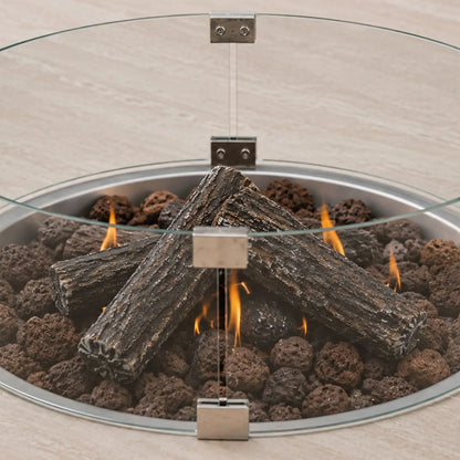 Cosiloft Novi Taupe Beige Outdoor Gas Fire Pit Coffee Table close up with Cosiglass Round Wind Guard, ceramic logs and lava stones | Click Style