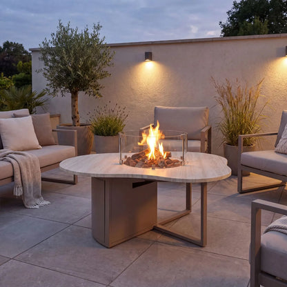 Cosiloft Novi Taupe Beige Organic Shaped Aluminium Outdoor Gas Fire Pit Table with Stone Look Top and Glass Wind Guard styled in a contemporary garden 47x120x90cm | Click Style