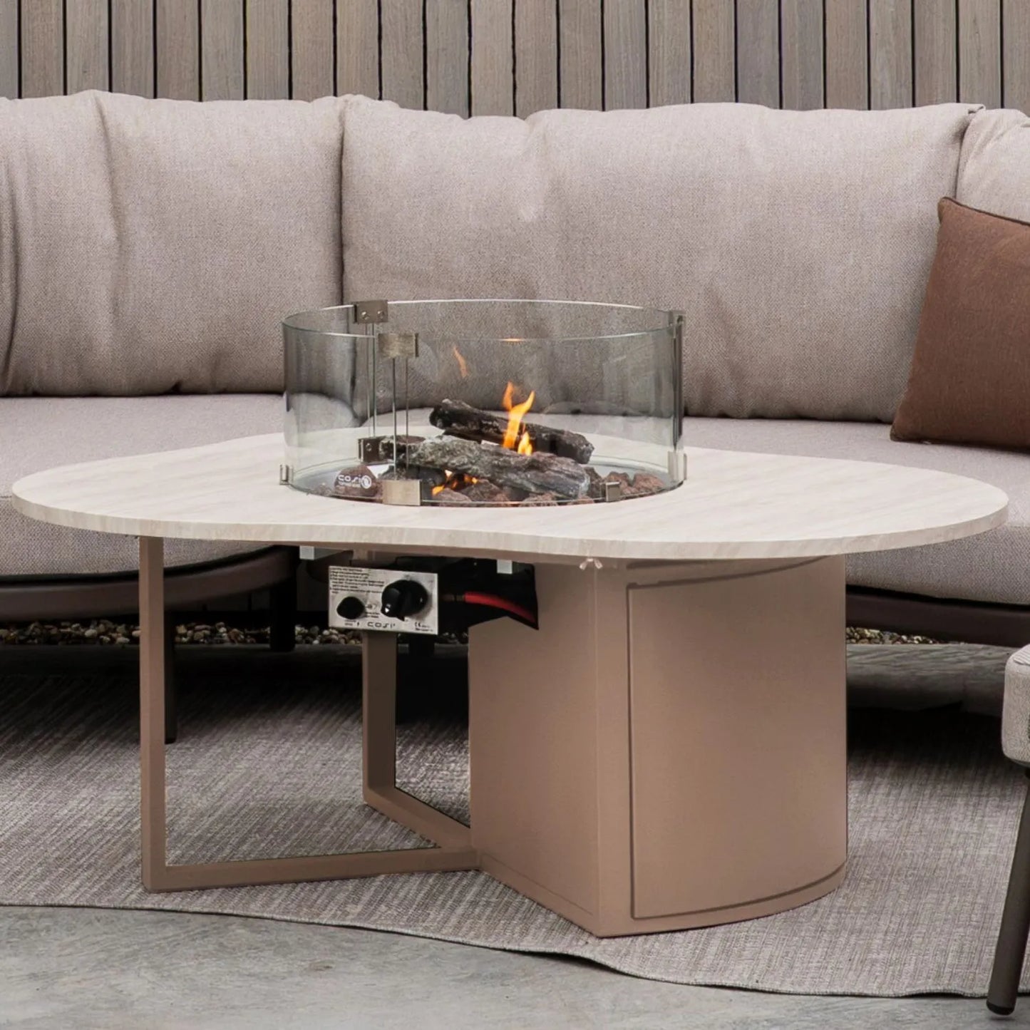 Cosiloft Novi Taupe Beige Organic Shaped Aluminium Outdoor Gas Fire Pit Coffee Table styled in a contemporary outdoor living space 47x120x90cm | Click Style