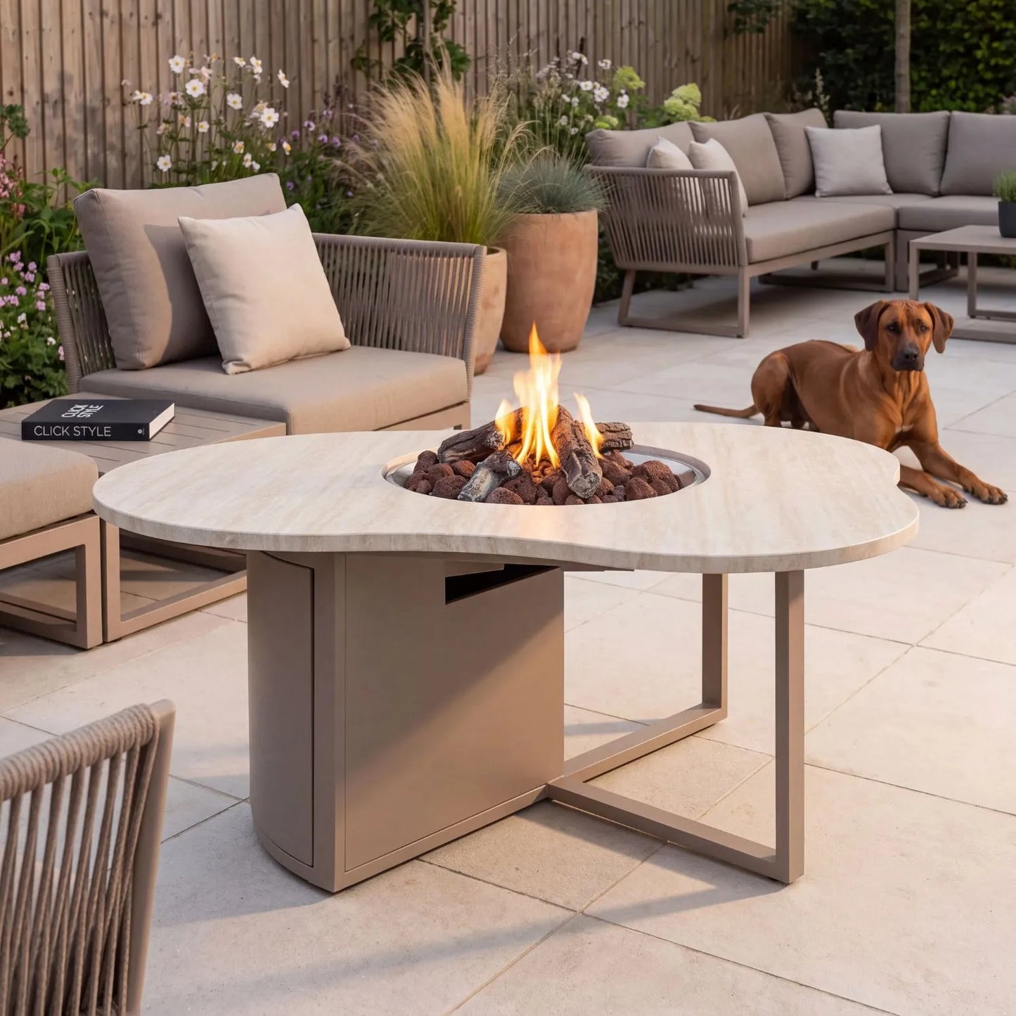 Cosiloft Novi Taupe Beige Organic Shaped Aluminium Outdoor Gas Fire Pit Table with Stone Look Top styled in a contemporary garden with a Rhodesian Ridgeback and Click Style branding 47x120x90cm | Click Style