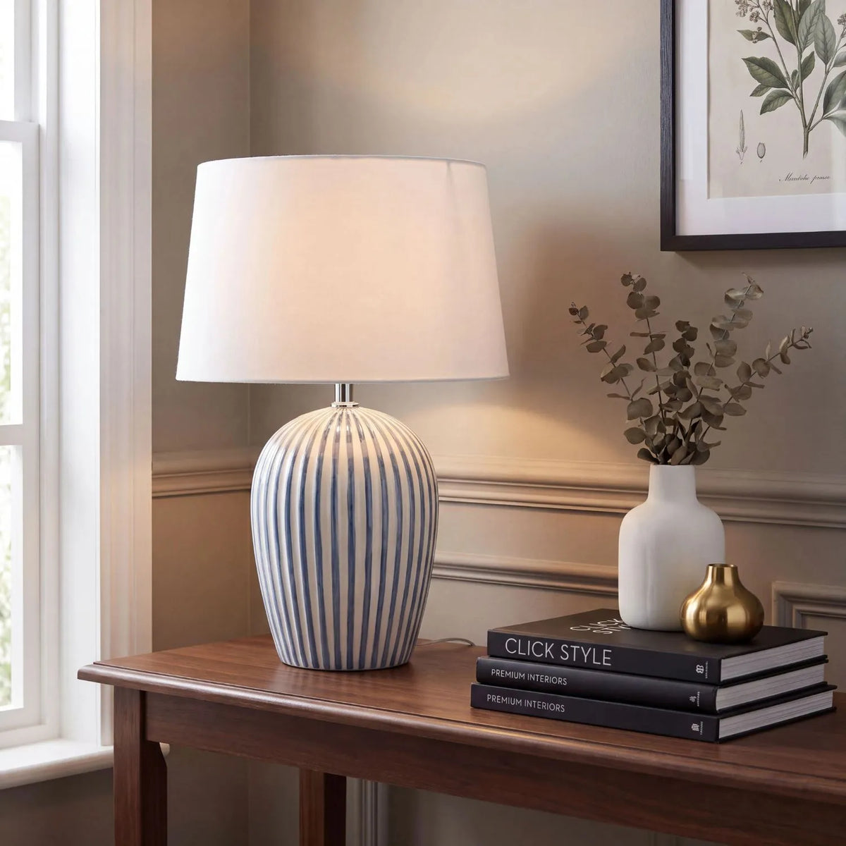 Denim Blue & White Striped Ceramic Table Lamp with White Cotton Tapered Shade – Ribbed Bulbous Base Bedside Light 45x30x30cm styled on a wooden console table in a warm neutral home interior | Click Style