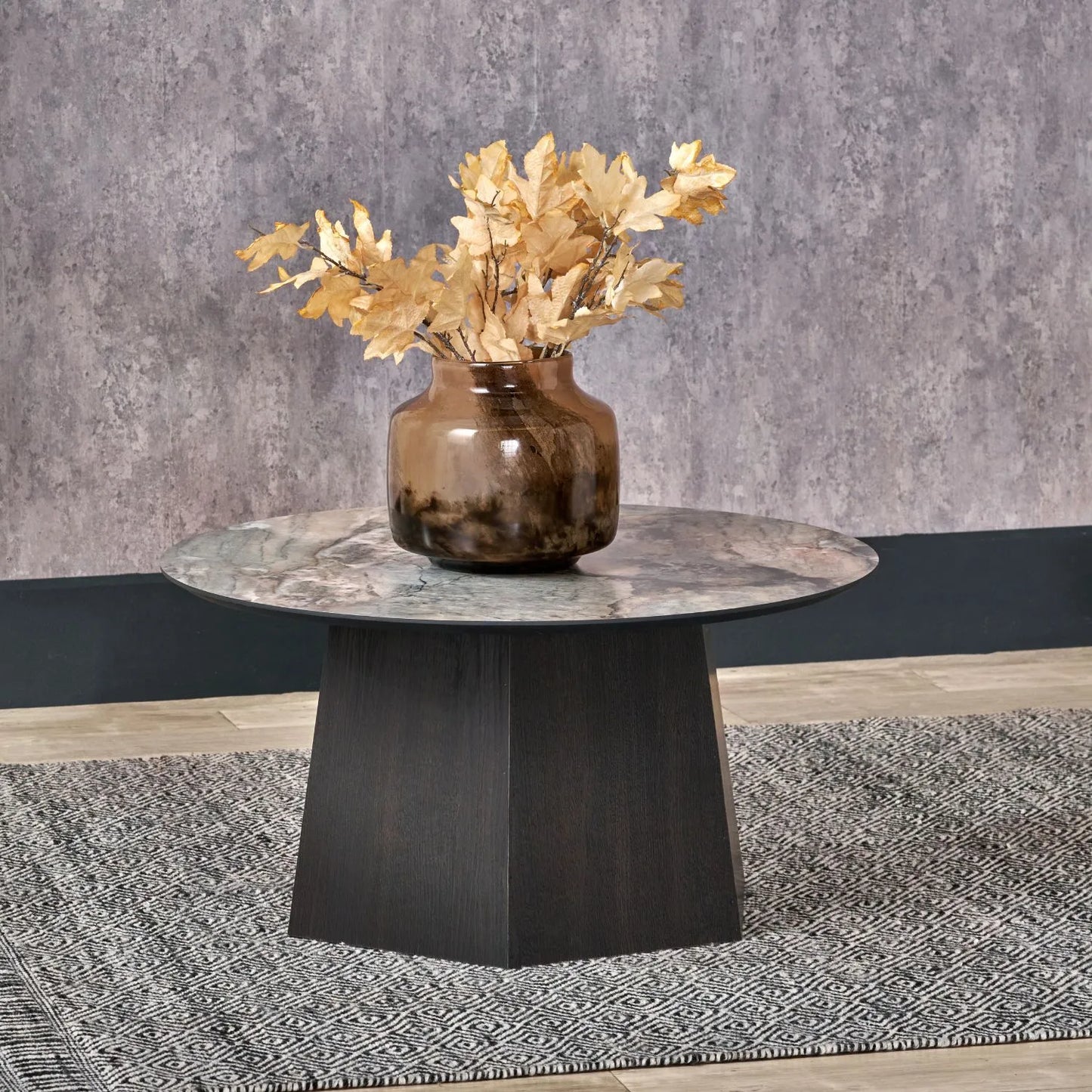 Grey Marble Effect Round Coffee Table with Stone Veneer Top & Dark Brown Pedestal Base – Contemporary Pedestal Coffee Table for Living Rooms 40x80x80cm with faceted pedestal base and marble-effect stone veneer top in grey, charcoal and cream veining | Click Style