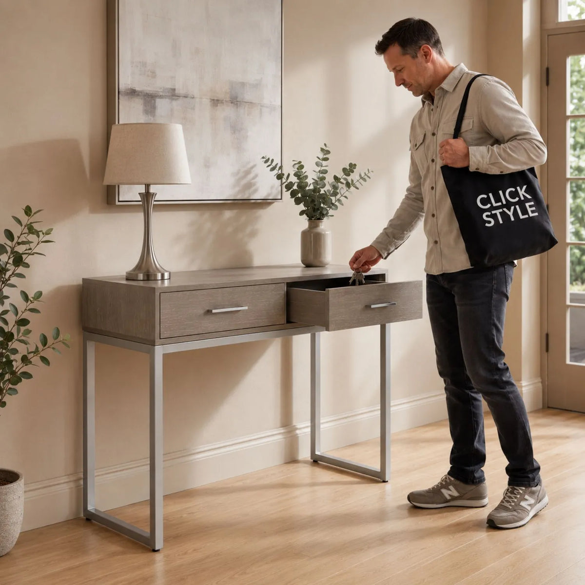 Grey Wash Mango Wood 2 Drawer Dressing Table & Desk with Silver Metal Handles & Legs used as a hallway console table with man opening drawer | Click Style