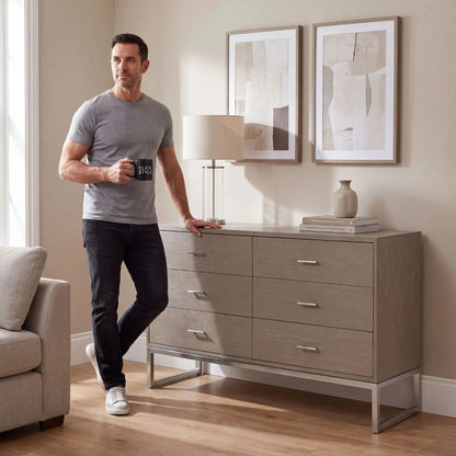 Grey Wash Mango Wood 6 Drawer Chest of Drawers with Silver Metal Handles & Legs 73x130x49cm styled in a contemporary living room with Damian | Click Style