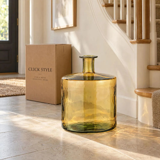 Large Amber Yellow Recycled Glass Bottle Vase with Narrow Neck – Wide Decorative Floor Vase 45x35x35cm – Displayed Empty in a Sunlit Hallway Beside a Curved Staircase | Click Style