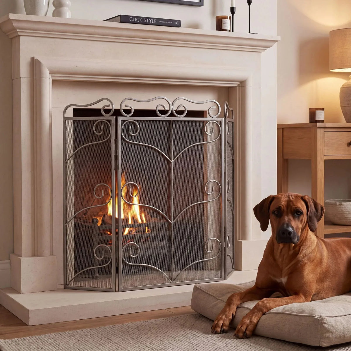 Large Antique Silver 3 Panel Folding Firescreen with Ornate Scrollwork – Steel Fireplace Fire Guard 75x85x2cm in a cosy fireside living room with Rhodesian Ridgeback | Click Style
