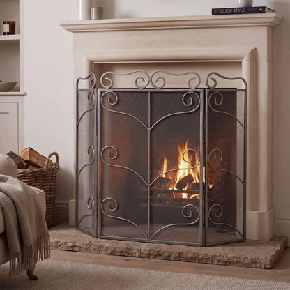 Large Antique Silver 3 Panel Folding Firescreen with Ornate Scrollwork – Steel Fireplace Fire Guard 75x85x2cm styled in front of a stone fireplace | Click Style