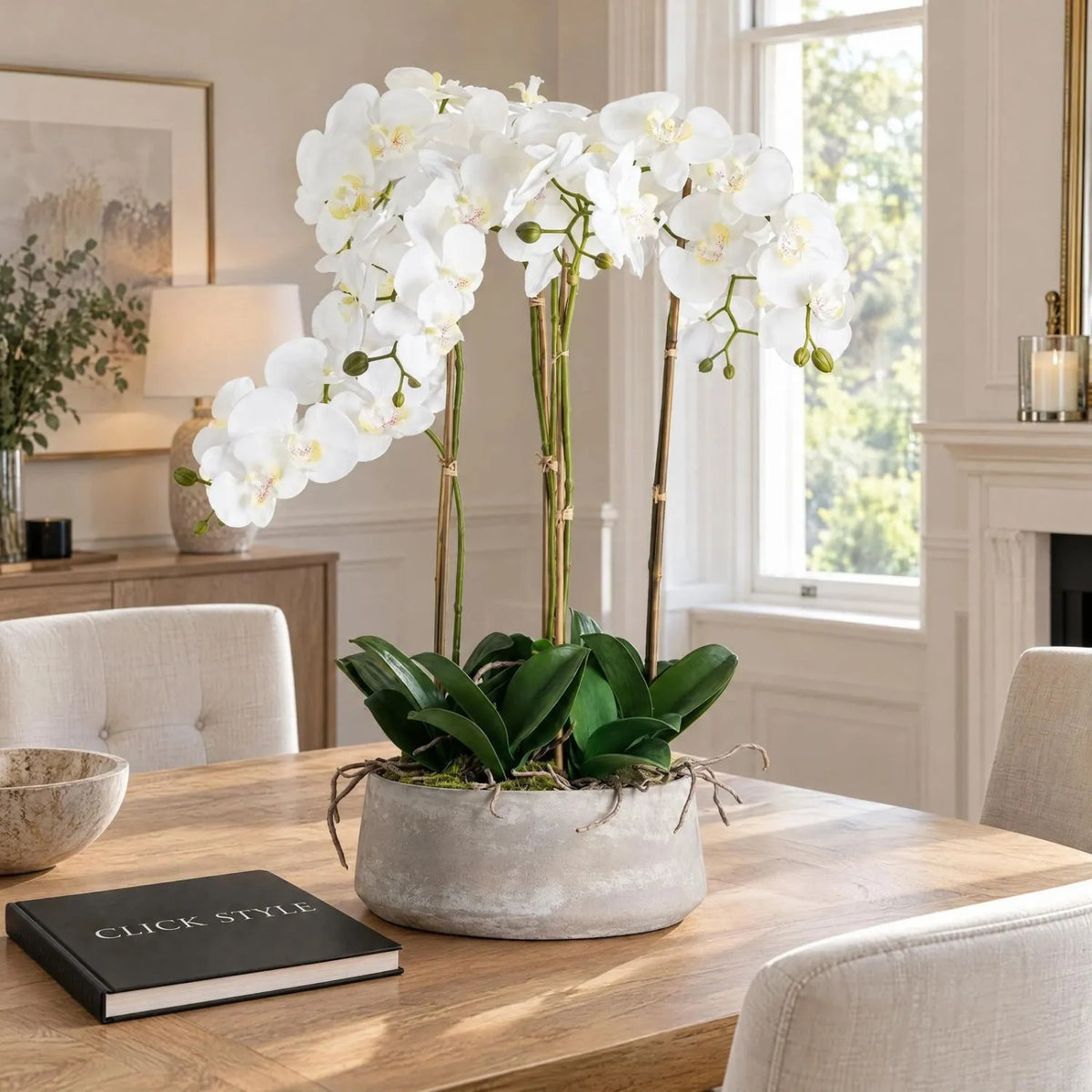 Large Artificial White Orchid with Cascading Blooms in Grey Stone Effect Pot on a Light Oak Dining Table with Black CLICK STYLE Book | Click Style