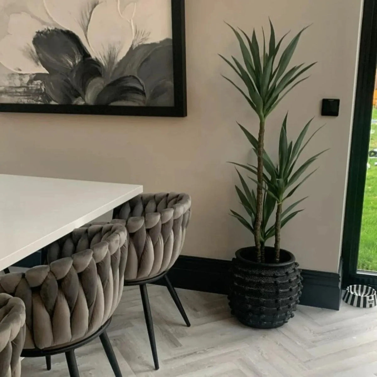 Large Black Bobbled Fibrestone Planter with Rolled Rim & Raised Textured Detail – Decorative Indoor Plant Pot 39x42x42cm – Customer Image Styled with Tall Green Plant in Dining Room | Click Style