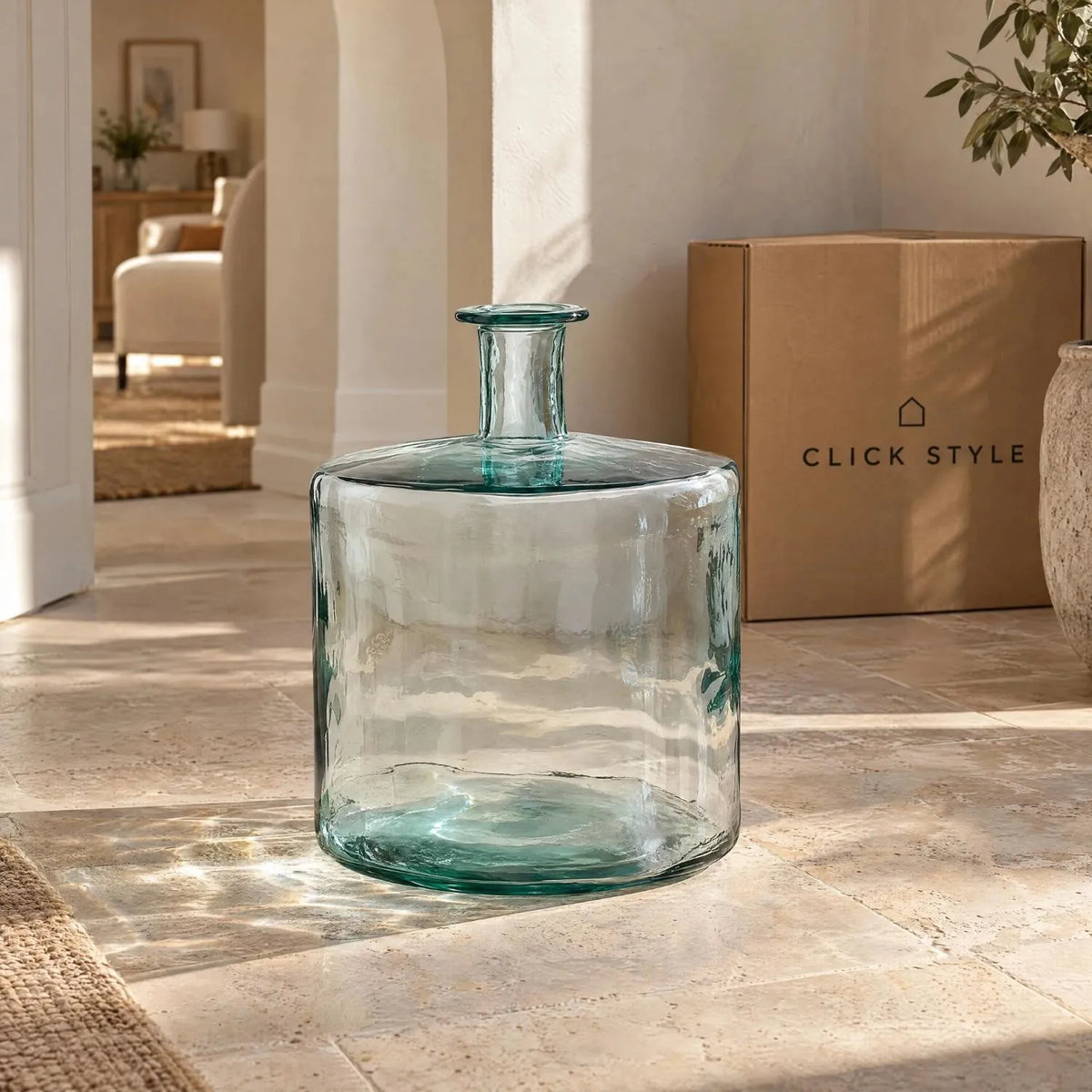 Large Clear Recycled Glass Bottle Vase with Narrow Neck – Wide Decorative Floor Vase 45x35x35cm – Displayed Empty in a Sunlit Neutral Hallway | Click Style