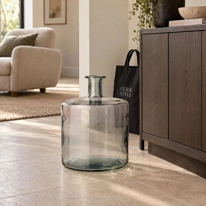 Large Grey Recycled Glass Bottle Vase with Narrow Neck – Wide Decorative Floor Vase 45x35x35cm – Displayed Empty Beside a Dark Wood Sideboard in a Neutral Living Room | Click Style